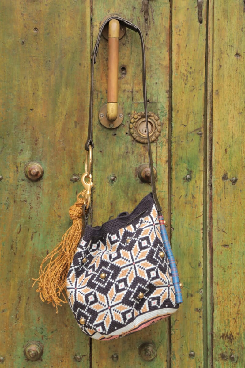 Wayuu handbag made by Claudia Akel hanging on a door in the Historic Center of Cartagena